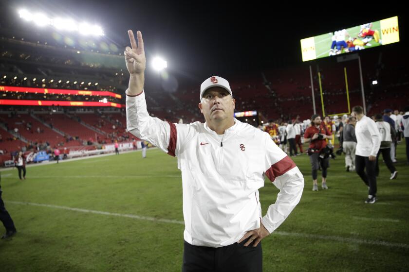 Southern California head coach Clay Helton celebrates after a win over Arizona in an NCAA college football game Saturday, Oct. 19, 2019, in Los Angeles. (AP Photo/Marcio Jose Sanchez)