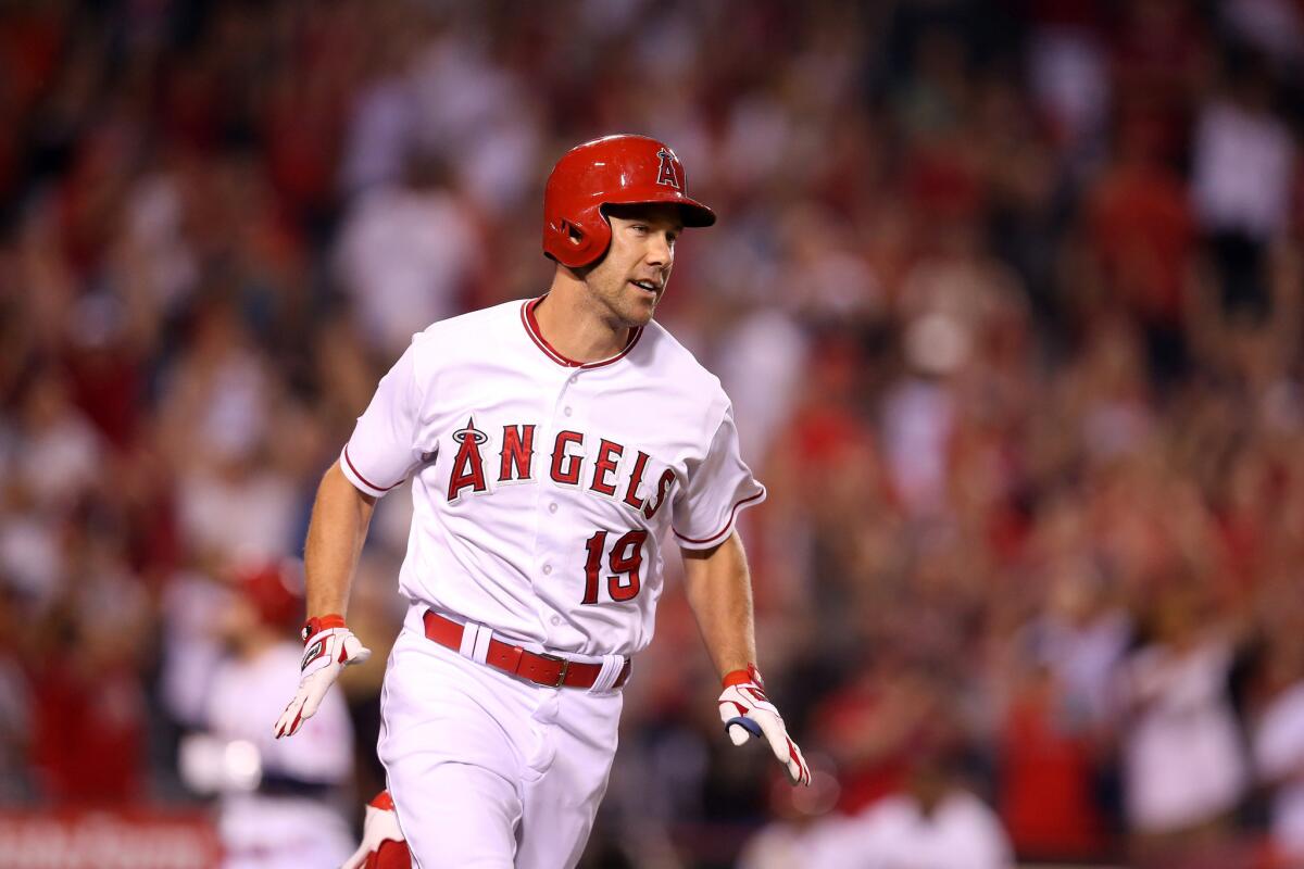 Angels outfielder David Murphy runs to first base after hitting his walk-off RBI single against the Athletics.