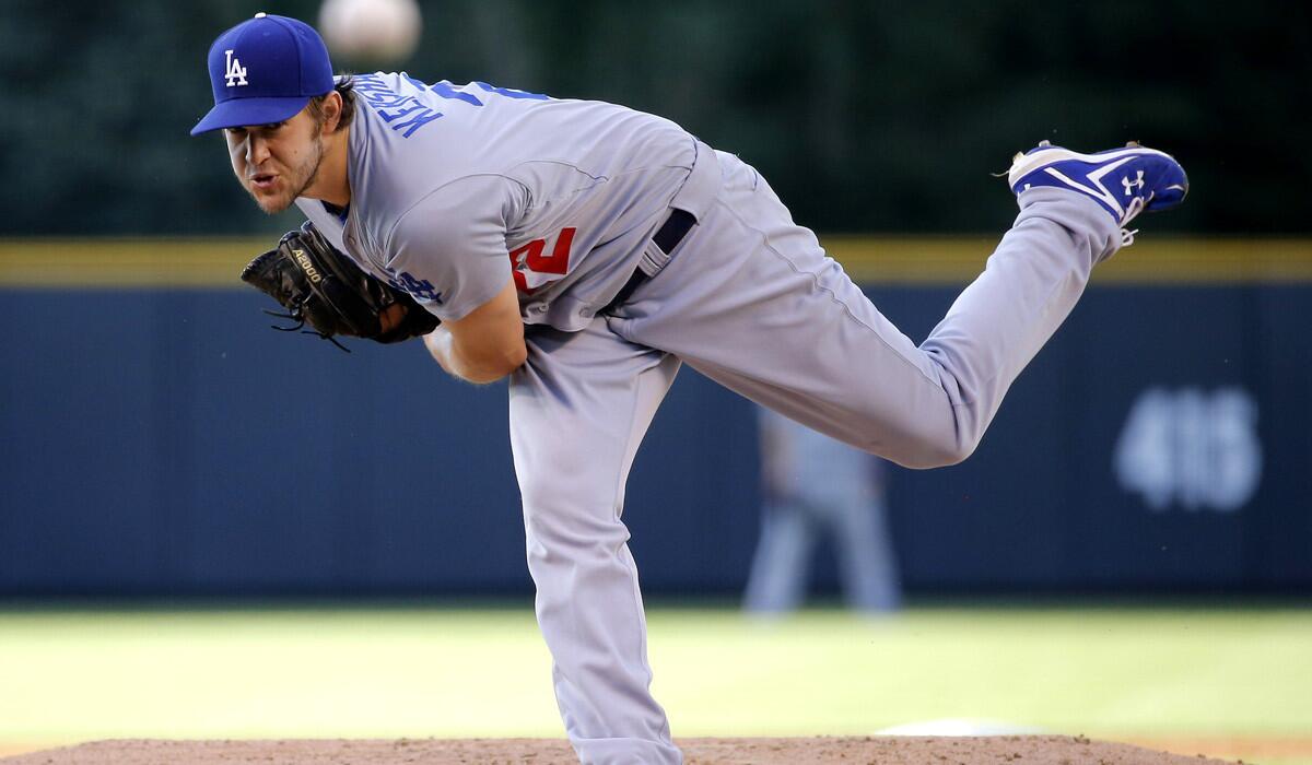 Los Angeles Dodgers starting pitcher Clayton Kershaw pitches against the Colorado Rockies during the first inning on Monday.