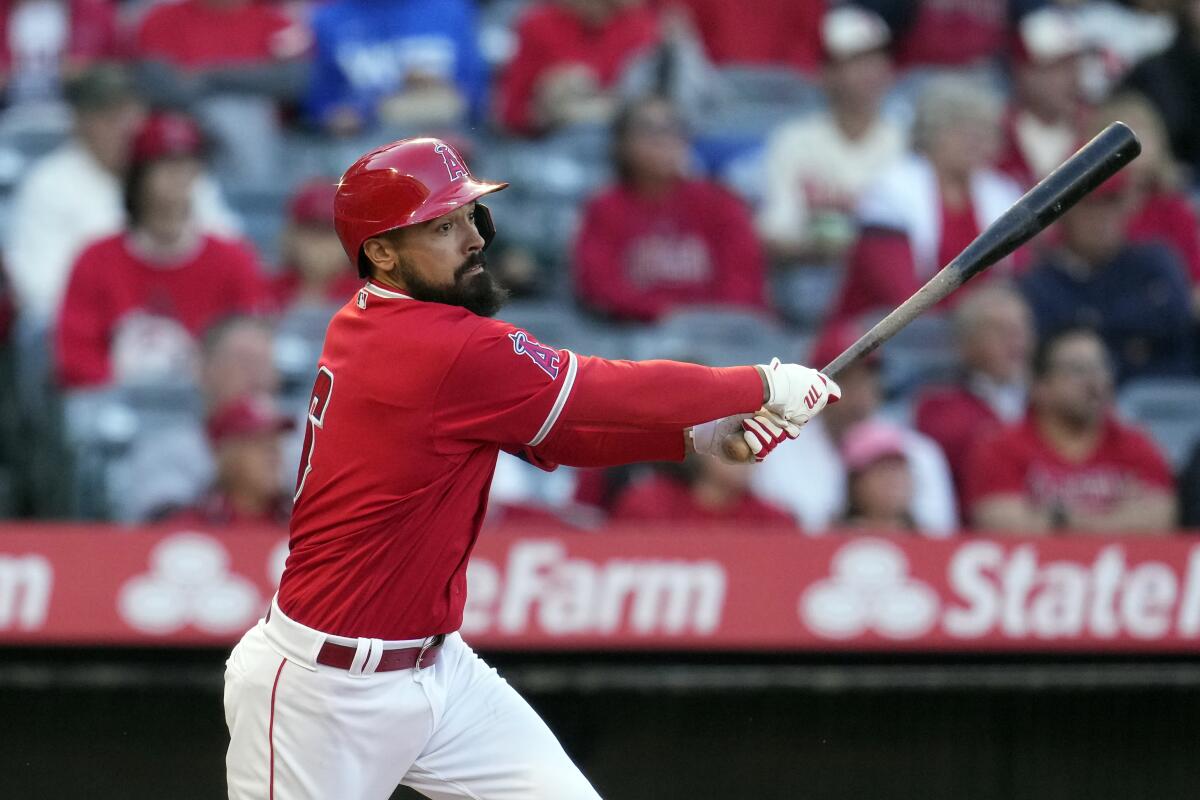 Angels' Anthony Rendon follows through on an RBI double during the first inning of a spring training game.