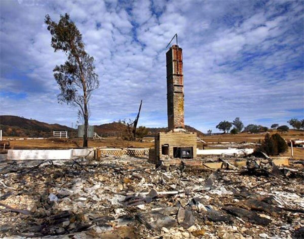 Only a chimney remains standing at the site of a home destroyed in the 2007 Witch Creek fire in San Diego County.
