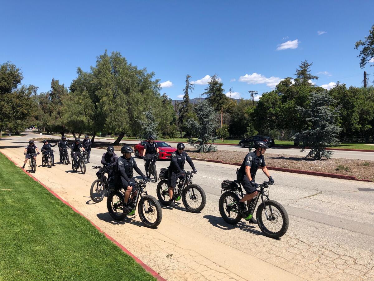 Los Angeles closed Griffith Park's trail network on Wednesday, but many hikers, walkers and cyclists remained on roads and grass Thursday, including these LAPD officers on patrol.
