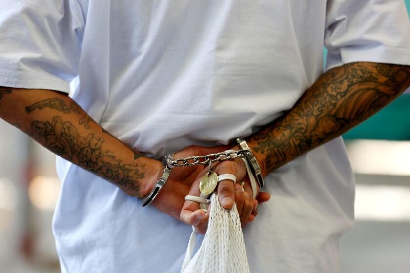 SAN QUENTIN, CALIF. -- TUESDAY, AUGUST 16, 2016: A death row inmate makes his way to his East Block cell after spending time in the yard at San Quentin State Prison, San Quentin, Calif., on Aug. 16, 2016. San Quentin opened in July 1852, it is the oldest prison in California. It houses the state's only death row for male inmates, the largest in the United States. (Gary Coronado / Los Angeles Times)