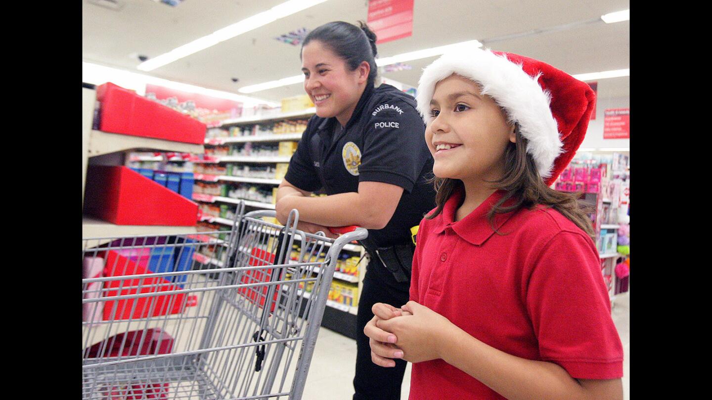 Photo Gallery: Boys and Girls Club of Burbank and Burbank Police Department work together shop for Christmas gifts at Kmart