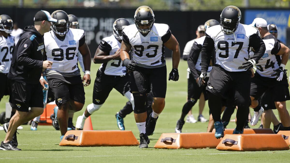 Jacksonville Jaguars defensive players take part in a mini-camp drill on June 3. An appeals court has overturned a decision that had closed the door on a collusion claim by the NFL Players Assn.
