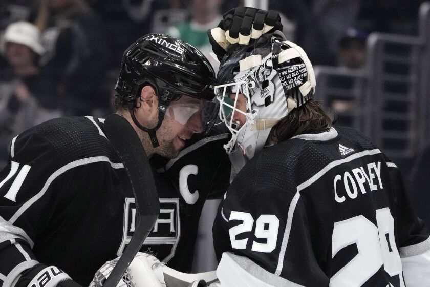 Los Angeles Kings center Anze Kopitar (11) celebrates with goaltender Pheonix Copley (29) after the team's 4-1 win over the Columbus Blue Jackets in an NHL hockey game Thursday, March 16, 2023, in Los Angeles. (AP Photo/Marcio Jose Sanchez)