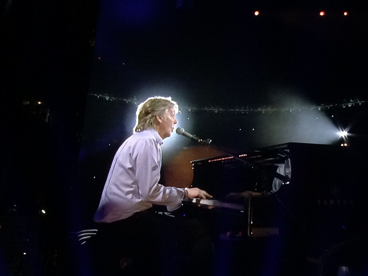 Paul McCartney at the piano, performing during his 2019 Petco Park concert in San Diego.
