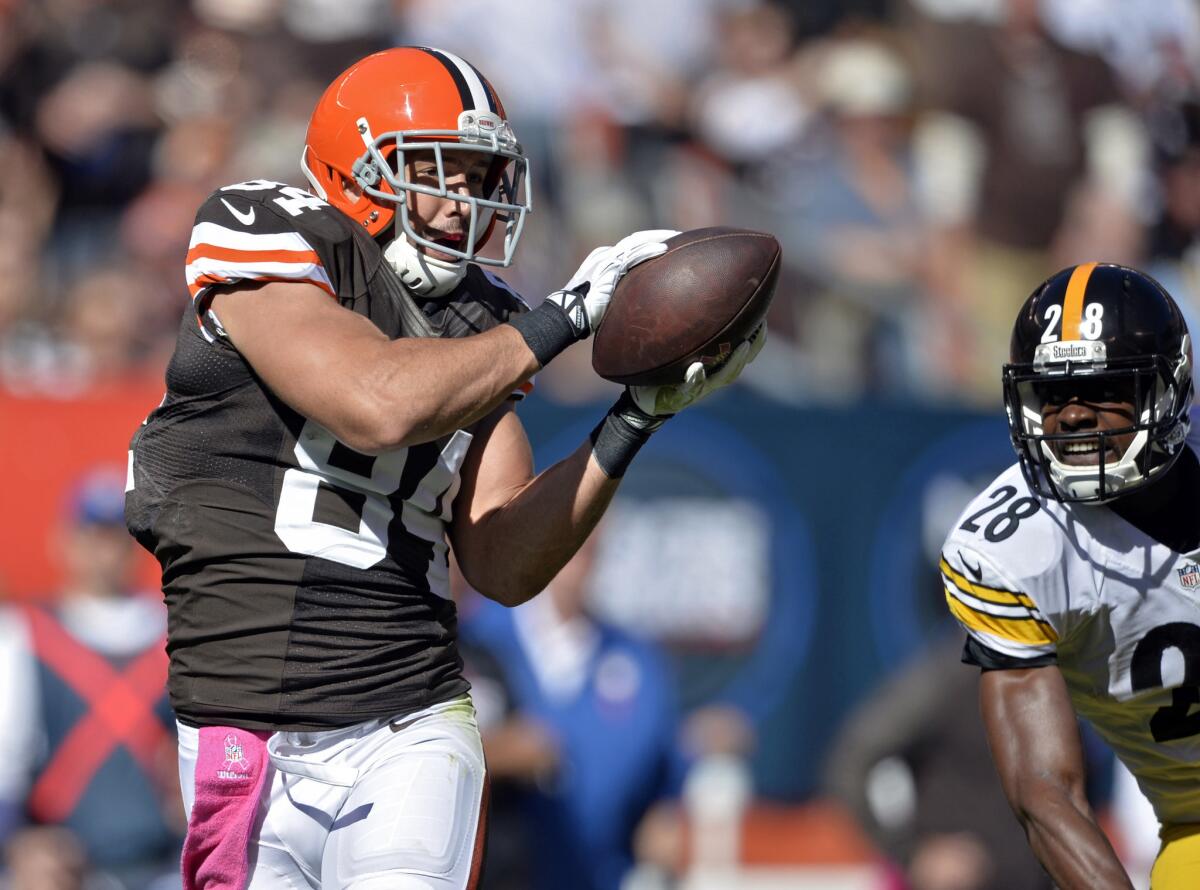 Tight end Jordan Cameron catches a touchdown pass with the Browns last season. Cameron signed with the Dolphins in the off-season.