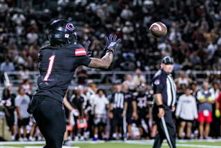 Receiver Quentin Hale of Corona Centennial shows off his hands and focus against Santa Margarita.