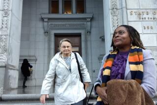 Milena (Sellers) Phillips (right) and Maria Keever as they arrive at the office complex in San Francisco where the California Supreme Court was to hear on Wednesday the appeal of a death sentence for the killer of their sons.