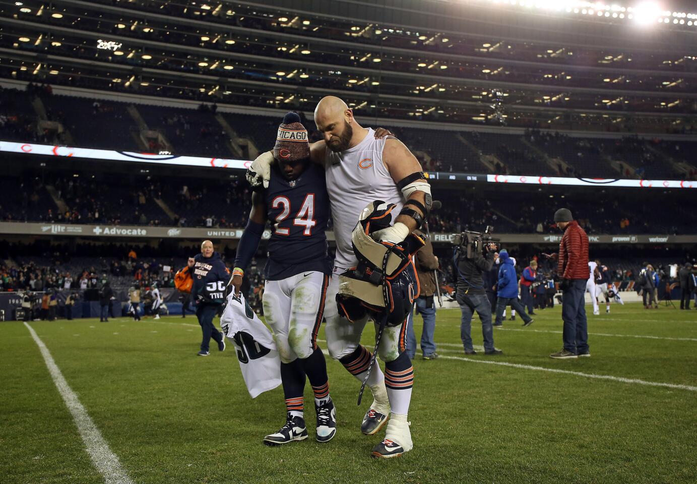 Bears running back Jordan Howard, left, and lineman Kyle Long walk off together after a playoff loss to the Eagles on Jan. 6, 2019, at Soldier Field.