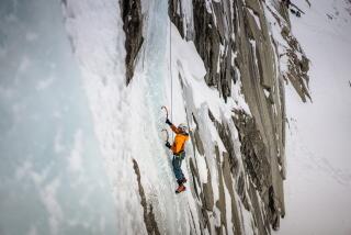 Climbers scale the ice cliffs at Lee Vining in Mammoth (Richard Bae / For The Times)