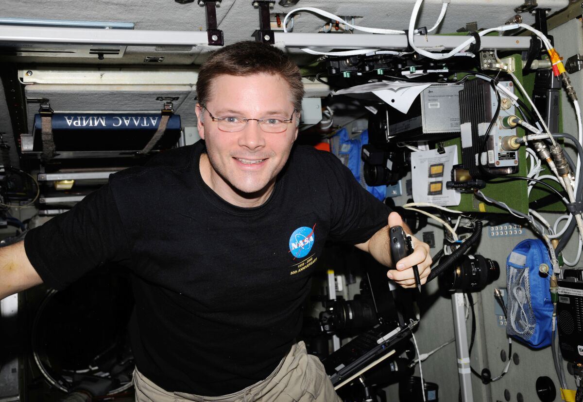 NASA astronaut Doug Wheelock uses a ham radio system at the International Space Station.