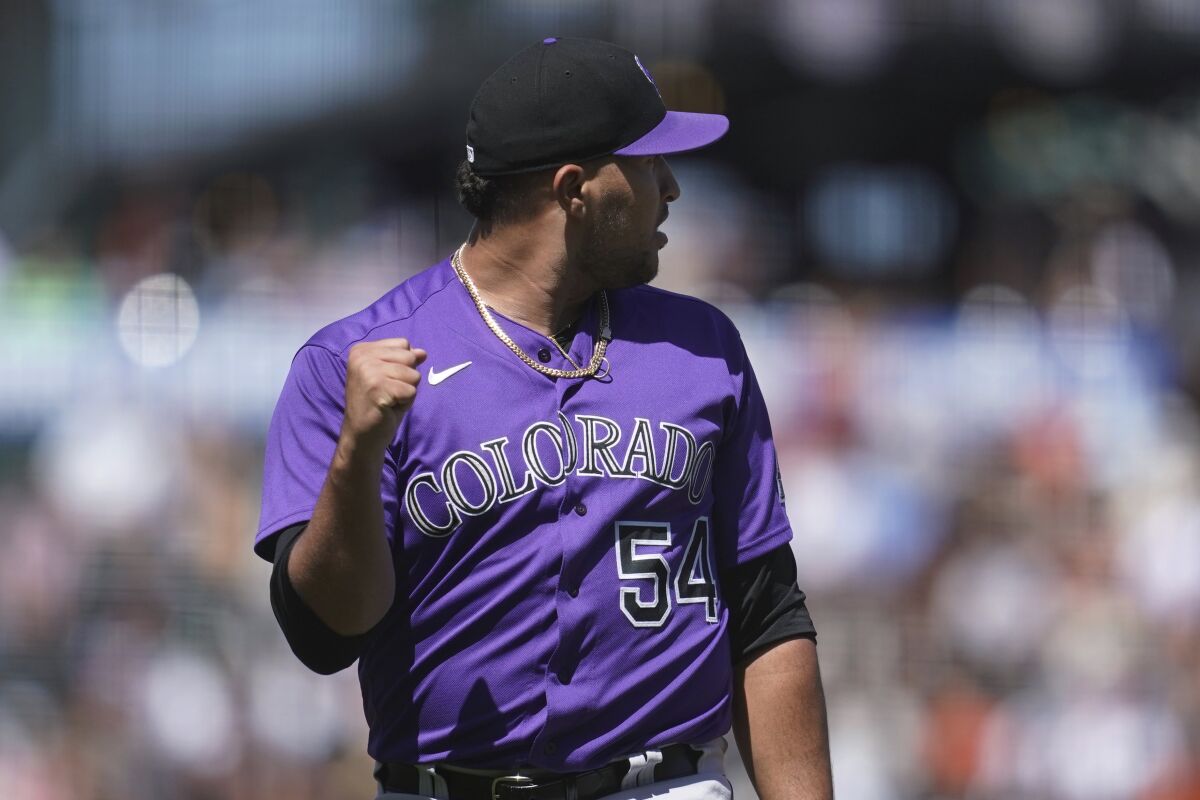 Colorado Rockies pitcher Carlos Estevez celebrates after retiring the San Francisco Giants during the eighth inning of a baseball game in San Francisco, Thursday, June 9, 2022. (AP Photo/Jeff Chiu)