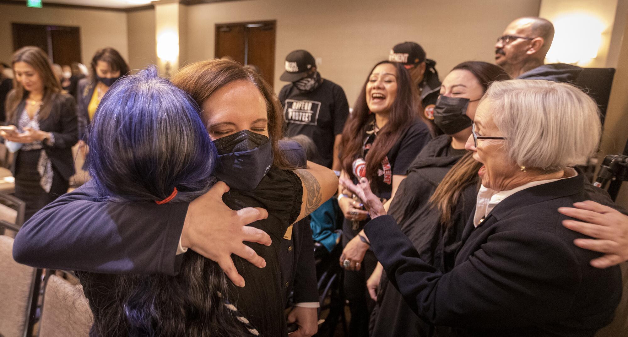 People celebrate the decision to reject the desalination plant.