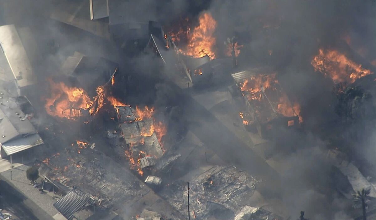 Mobile homes go up in flames in Calimesa on Thursday afternoon.