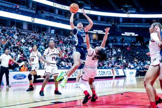 Juju Watkins of Sierra Canyon scores over Etiwanda's Aliyahna Morris in the Open Division girls' final at Honda Center.