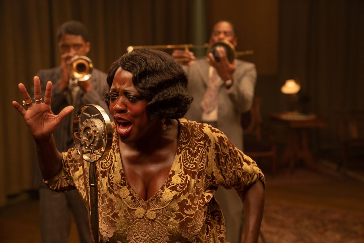 Viola Davis singing into an old-fashioned microphone in "Ma Rainey's Black Bottom."