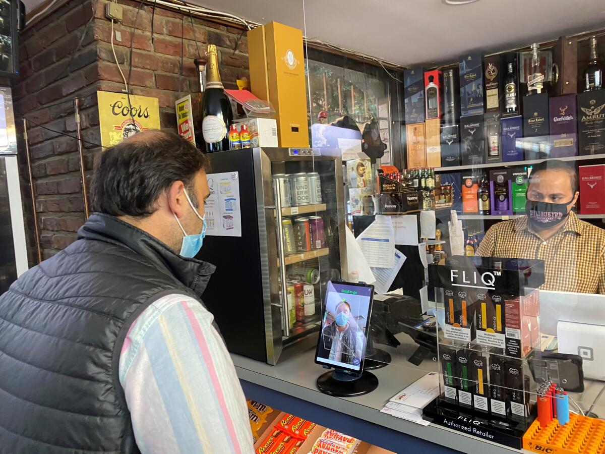 Sid Dilawri, left, owner of Modern Liquors in Washington, D.C.