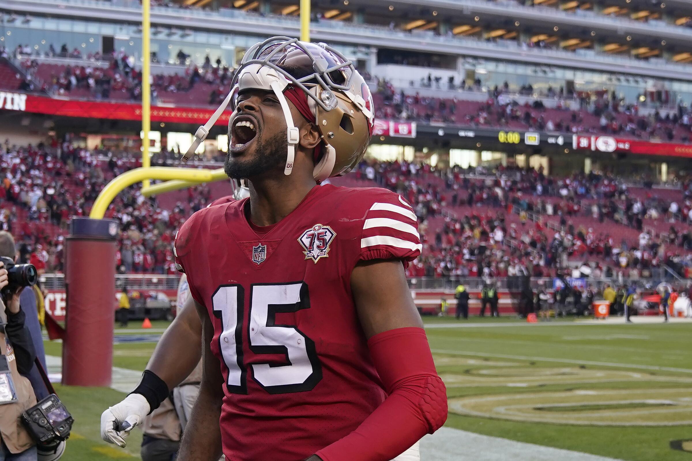 San Francisco 49ers wide receiver Jauan Jennings (15) celebrates toward fans after the 49ers' win over the Falcons.