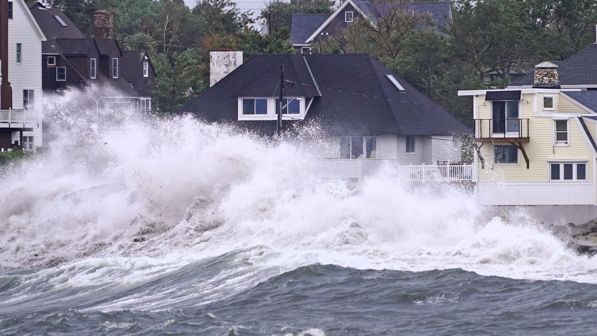 Waves are high near coastal homes.