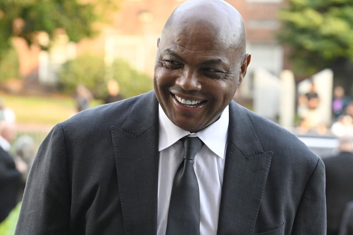 Charles Barkley smiles as he arrives at an event.