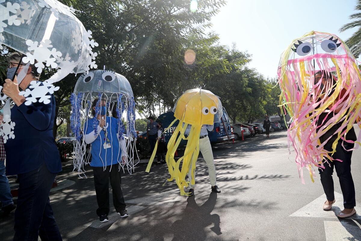 Staff members participate in the 14th annual Pediatric Trick-Or-Treat Parade at Fountain Valley Regional Hospital.