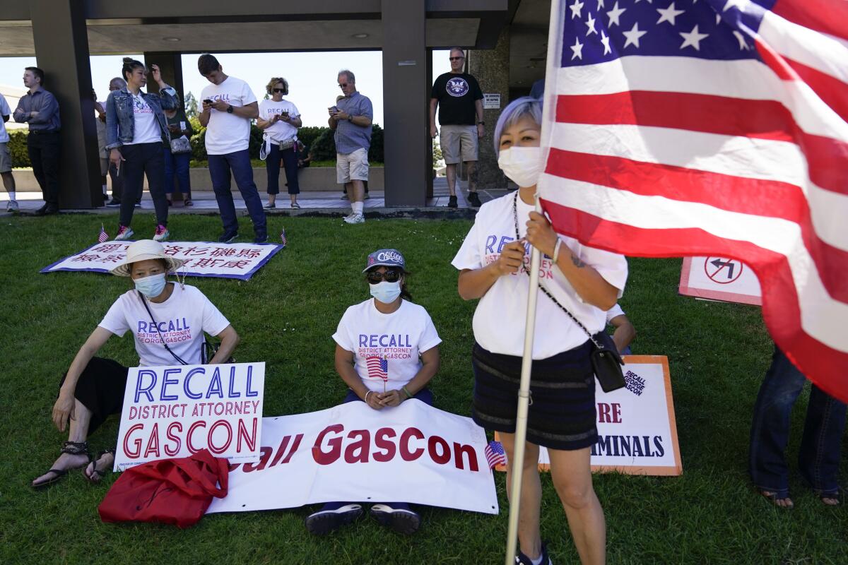 Supporters of a campaign to recall Los Angeles County District Attorney George Gascon gather outside the Los Angeles County Registrar of Voters on Wednesday, July 6, 2022, in Norwalk, Calif. (AP Photo/Ashley Landis)
