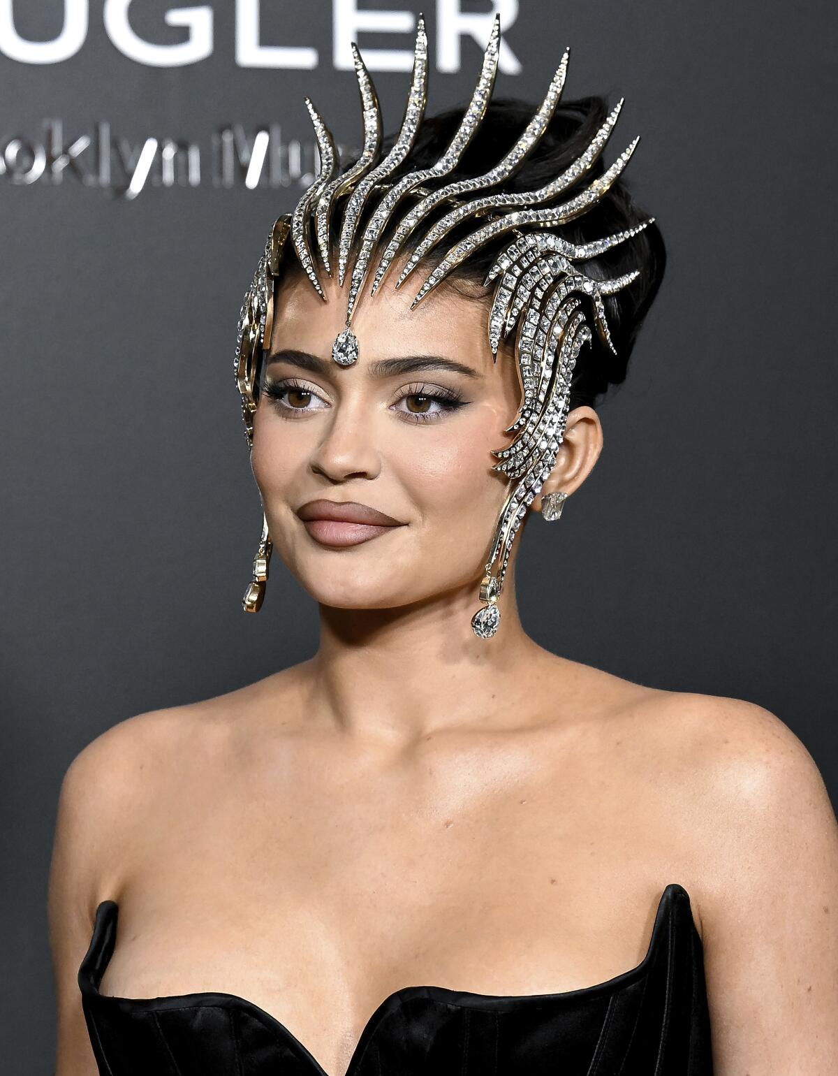 Kylie Jenner poses in a strapless gown and diamond encrusted headpiece