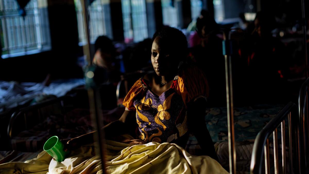 Expectant mothers lie on beds in the maternity ward of the Kalisizo General Hospital in Kalisizo, Uganda on May 31.