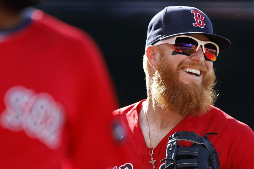 Justin Turner of the Boston Red Sox talks with manger Alex Cora News  Photo - Getty Images