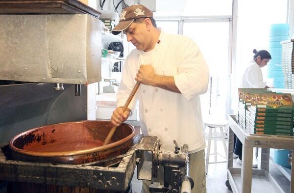 Armand Sahakian, owner of Nory Candy & Pastry in Winnetka, hand mixes almonds into a batch of Turkish Delight in a large copper pot. RELATED: Three generations of Turkish delight in Southern California