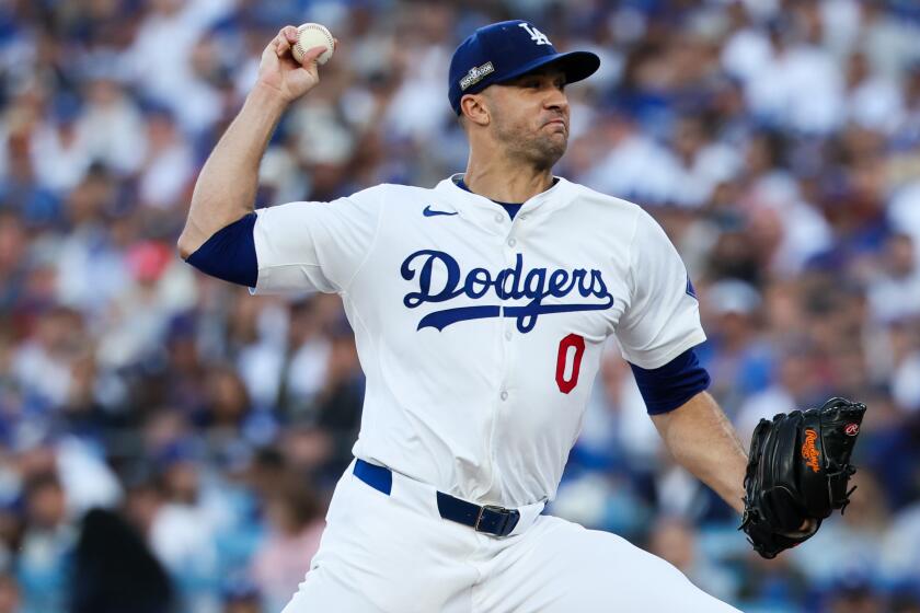 LOS ANGELES, CALIFORNIA - OCTOBER 13: Jack Flaherty #0 of the Los Angeles Dodgers delivers.