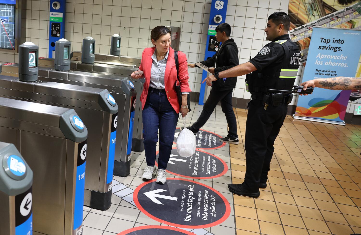 Image for display with article titled In an Effort to Stem Crime, Metro Demands Fare Cards as Riders Exit Station