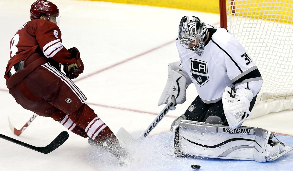 Kings goalie Martin Jones stops a shot by Coyotes center Tobias Rieder in the third period Thursday night.