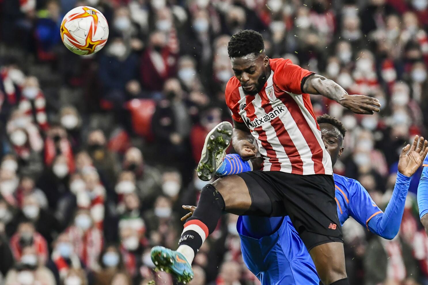 Valencia, Spain. 2nd Mar, 2022. Valencia's Gabriel Paulista vies with  Athletic Bilbao's Inaki Williams during the King Cup semifinal second leg  match between Valencia and Athletic Bilbao in Valencia, Spain, March 2, 2022.  Credit: Str/Xinhua/Alamy Live News