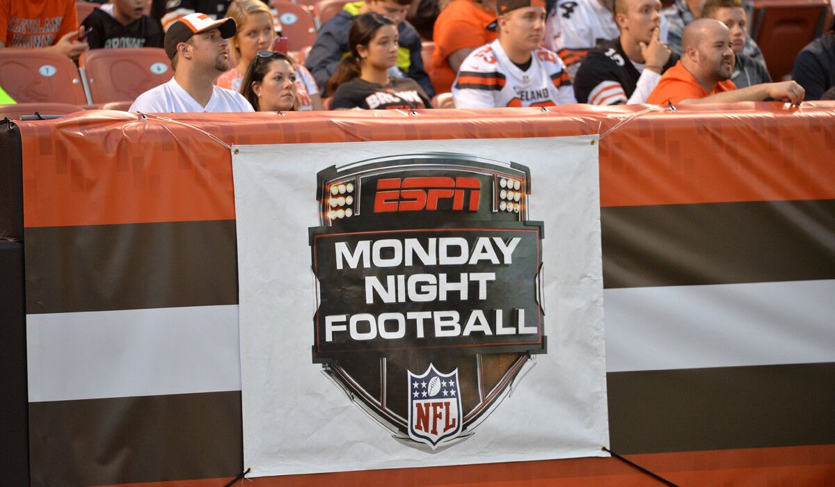 A sign for ESPN Monday Night Football hangs on the end zone wall during an NFL preseason football game between the Cleveland Browns and the Buffalo Bills on Aug. 20.