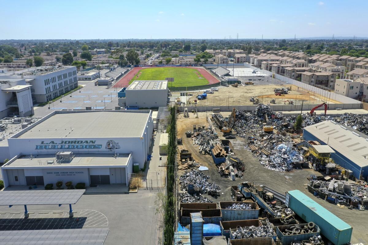 An aerial view of Atlas Iron & Metal Co., which is a metal recycler that has piles of metal scrap 