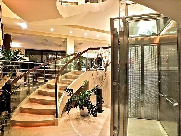 A stainless-steel-and-glass elevator is a focal point at a three-level contemporary in Naples listed at $6.75 million.