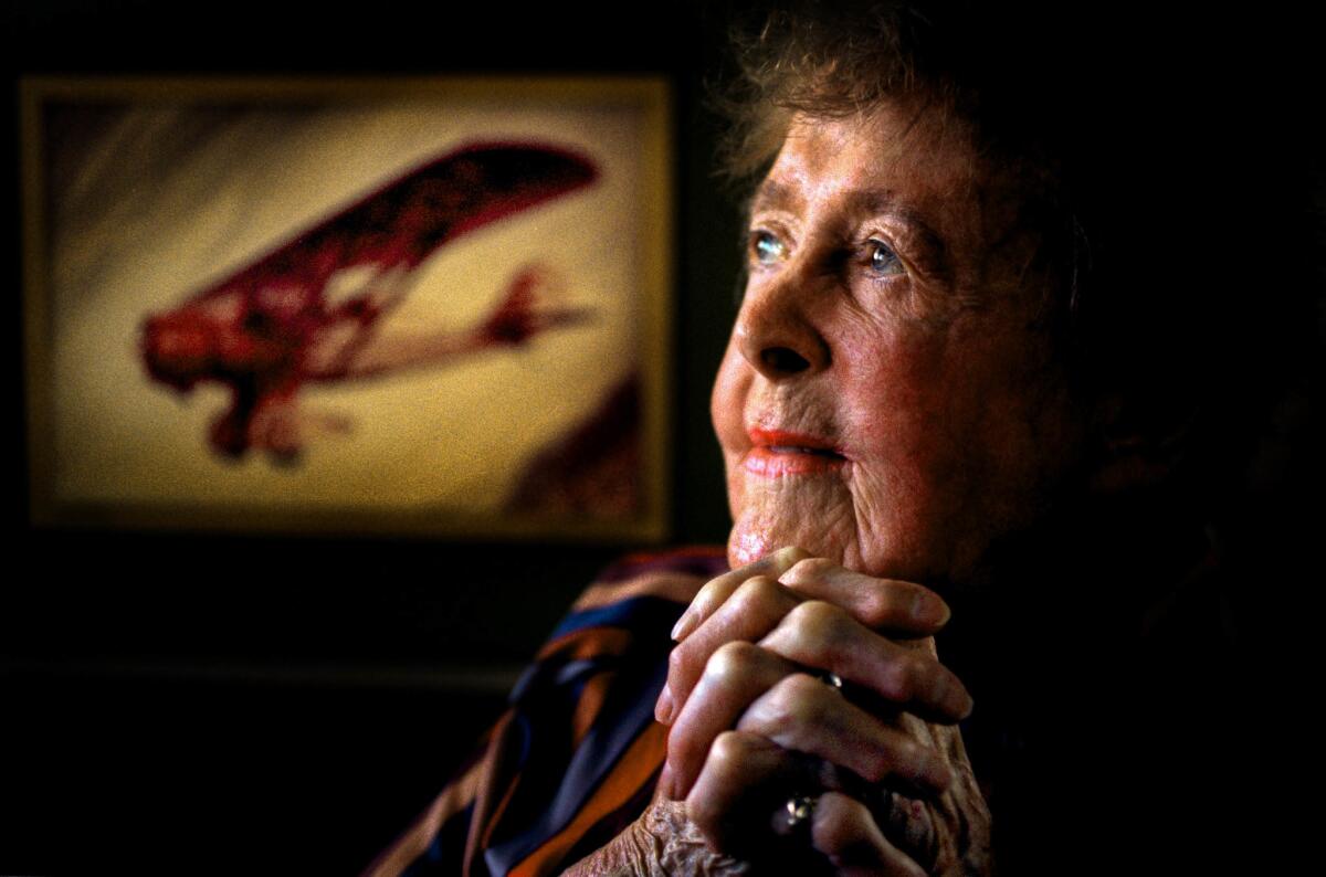 July 6, 1999: Evelyn 'Bobbie' Trout, 93, of Carlsbad, with a painting of her 1929 Golden Eagle Chief monoplane, was the honored guest at the 1999 Van Nuys Air Show, marking the 70th anniversary of her first endurance record.