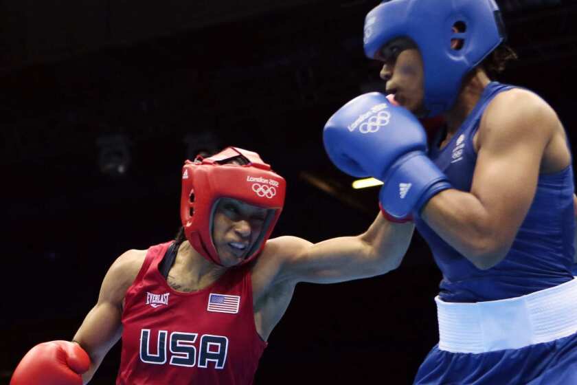 Team USA's Quanitta Underwood, whose fans know her as Queen, and Natasha Jonas of Great Britain fight during the women's lightweight boxing competition.