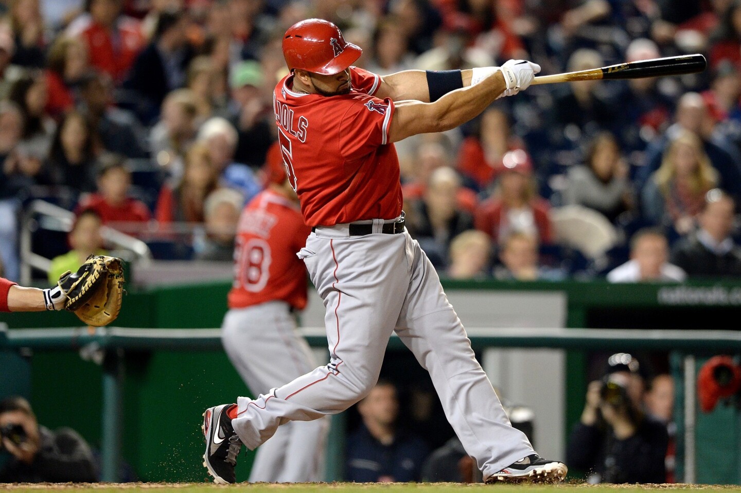 Angels first baseman Albert Pujols hits his 500th career home run -- a two-run blast -- during the fifth inning of Tuesday's game against the Washington Nationals.