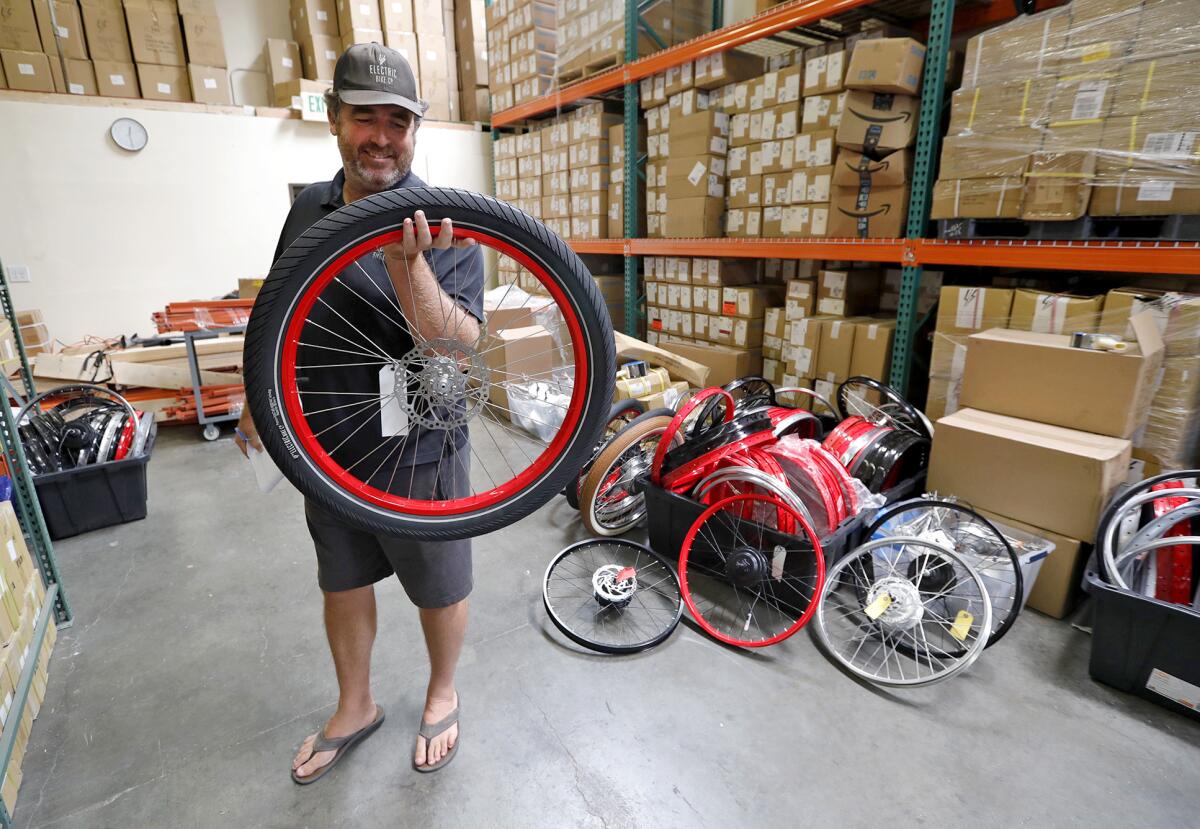 Owner Sean Lupton-Smith says he's happy to be in the new Electric Bike Co. production facility in Costa Mesa.`