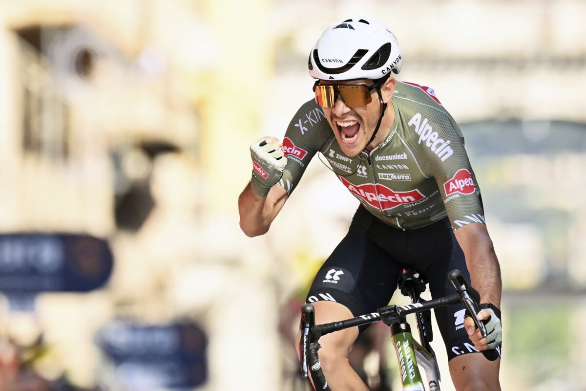 Italy's Stefano Oldani celebrates winning the 12th stage of the Giro D'Italia cycling race from Parma to Genoa, Italy, Thursday, May 19, 2022. (Fabio Ferrari/LaPresse via AP)