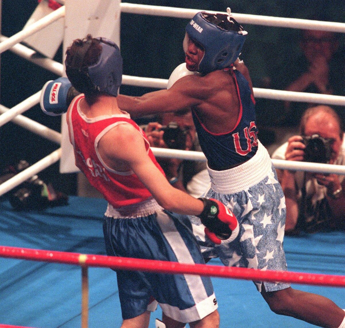 Floyd Mayweather, right, battles Bulgarian Serafim Todorov during a semifinal bout at the 1996 Olympics.