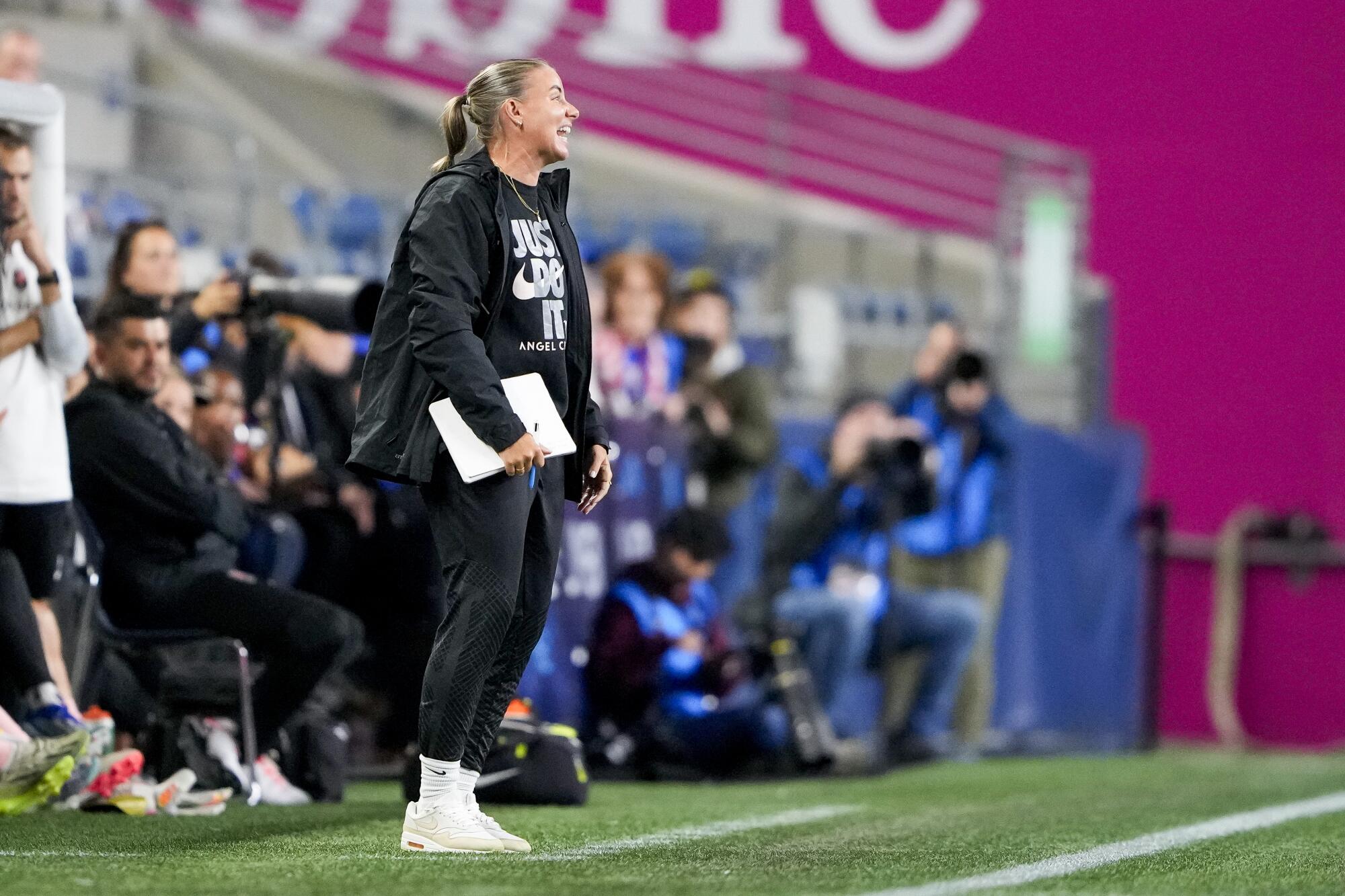 Angel City coach Becki Tweed shouts from the sideline during the team's 2023 match against OL Reign