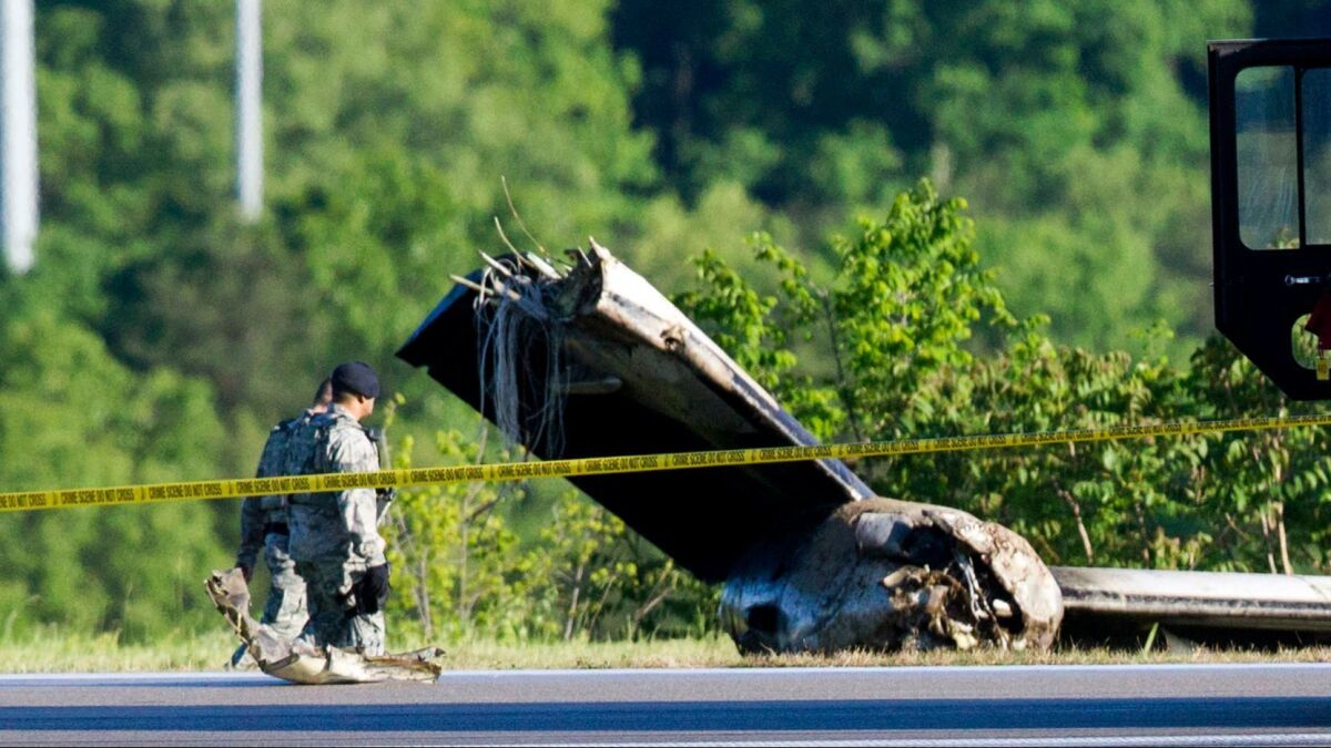 Part of a cargo plane lies on the ground following a fatal crash at Yeager Airport in Charleston, W.Va., on Friday.
