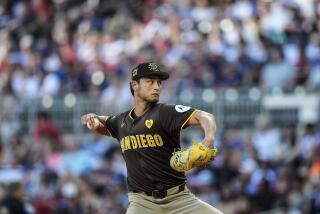 San Diego Padres pitcher Yu Darvish (11) works in the first inning of a baseball game against the Atlanta Braves, Sunday, May 19, 2024, in Atlanta. (AP Photo/Mike Stewart)