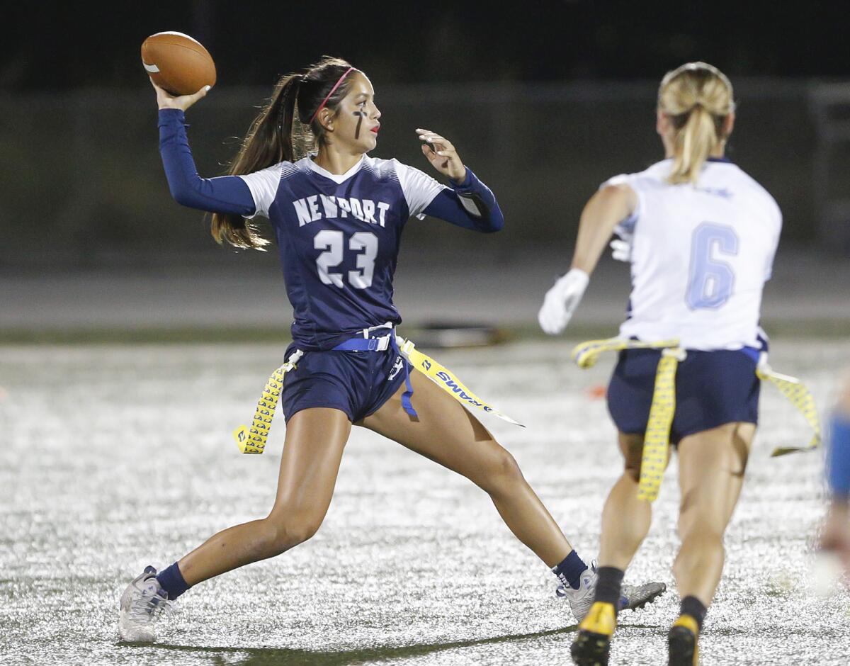 Newport Harbor's Maia Helmar (23) throws a pass during against rival Corona del Mar on Wednesday.