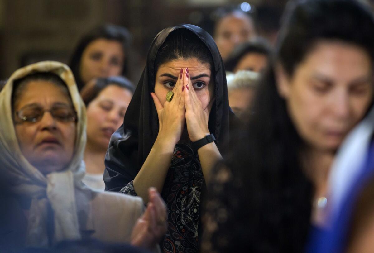 Coptic Christians attend prayers for the departed, remembering the victims of EgyptAir flight 804 at Al-Boutrossiya Church in Cairo, Egypt, on May 22, 2016.